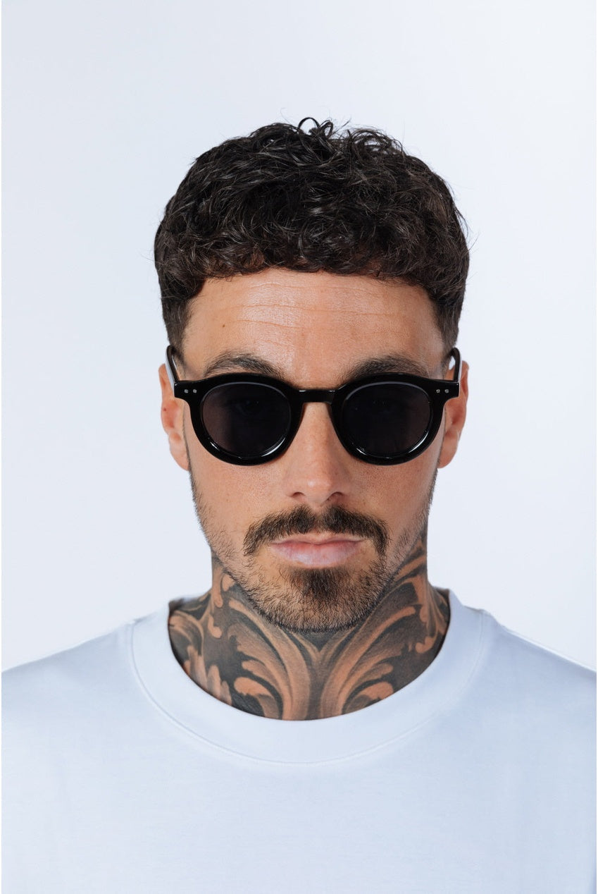 Bold Rounded Sunglasses In Black by SVNX