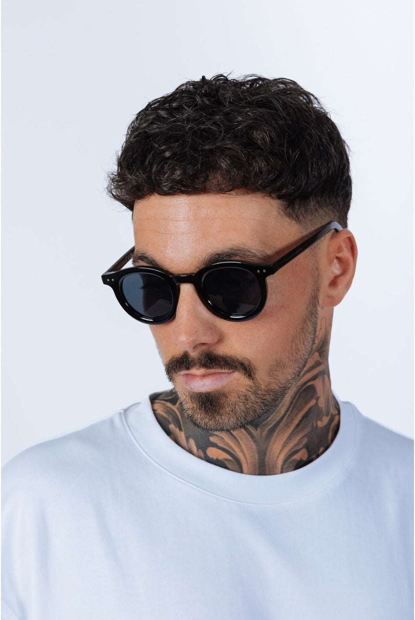 Bold Rounded Sunglasses In Black by SVNX