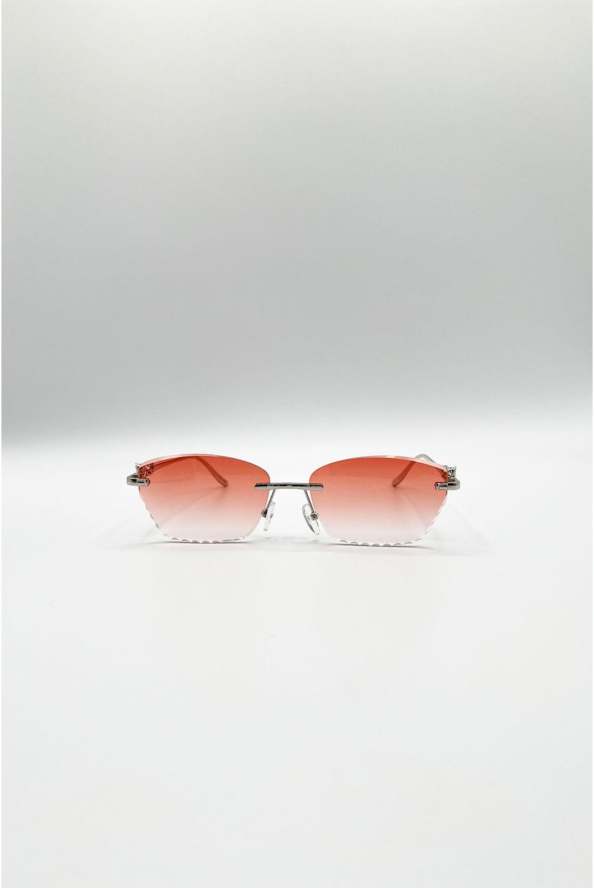 Cat Eye Rimless Sunglasses In Orange by SVNX
