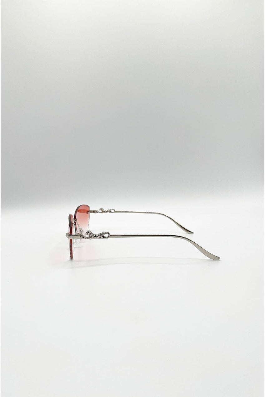 Cat Eye Rimless Sunglasses In Orange by SVNX