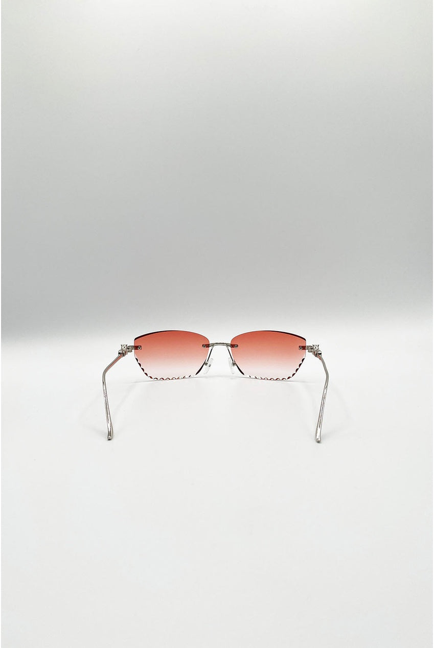 Cat Eye Rimless Sunglasses In Orange by SVNX