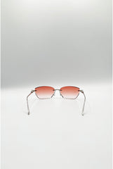 Cat Eye Rimless Sunglasses In Orange by SVNX